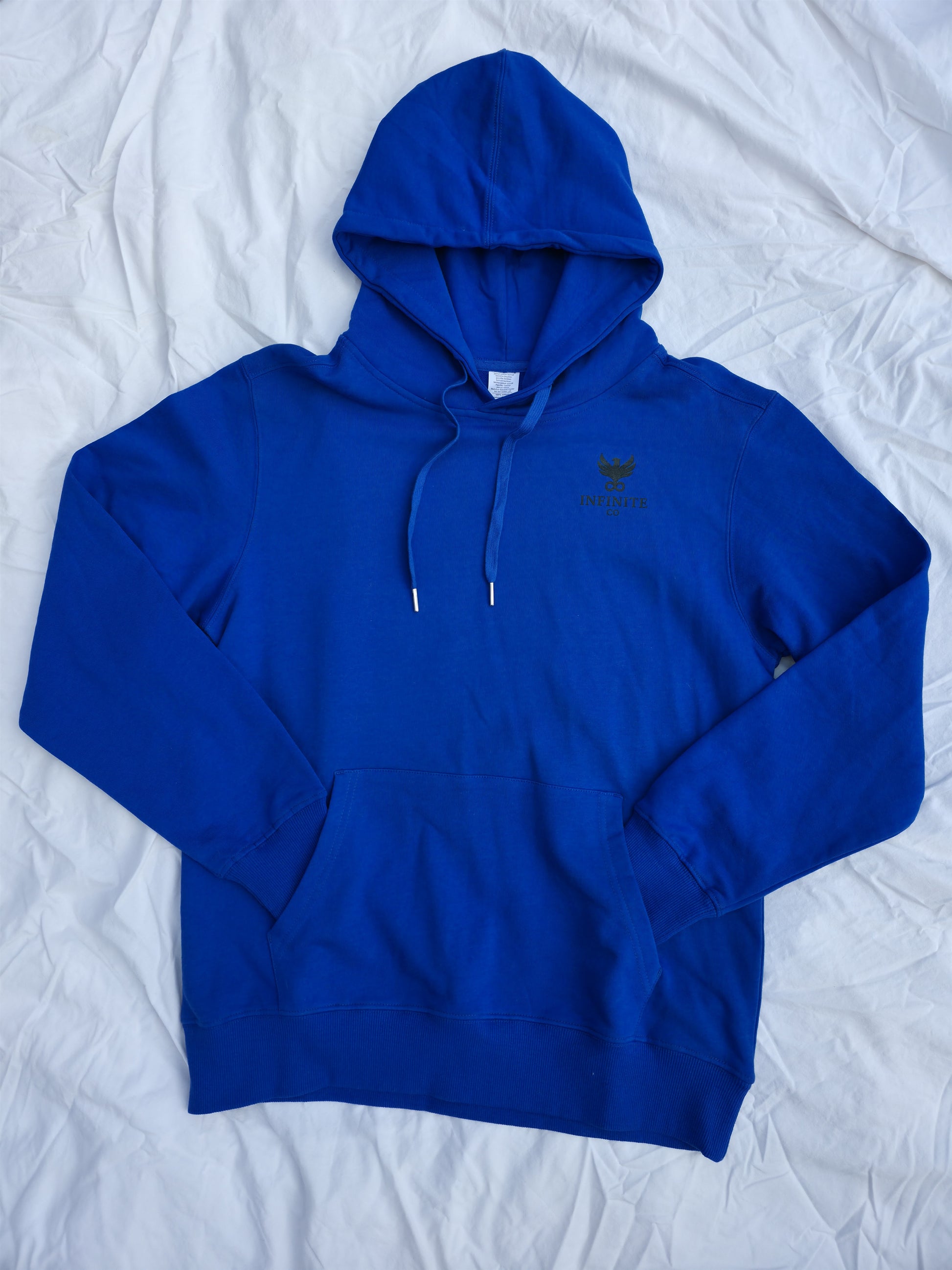 Blue 100% cotton hoodie featuring minimalist hand and ripple linework design symbolizing legacy from Infinite Co’s ECHOES collection, crafted from sustainable natural fibers for modern streetwear.