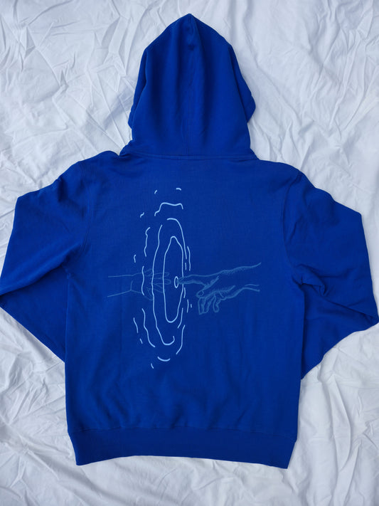 Blue 100% cotton hoodie featuring minimalist hand and ripple linework design symbolizing legacy from Infinite Co’s ECHOES collection, crafted from sustainable natural fibers for modern streetwear.